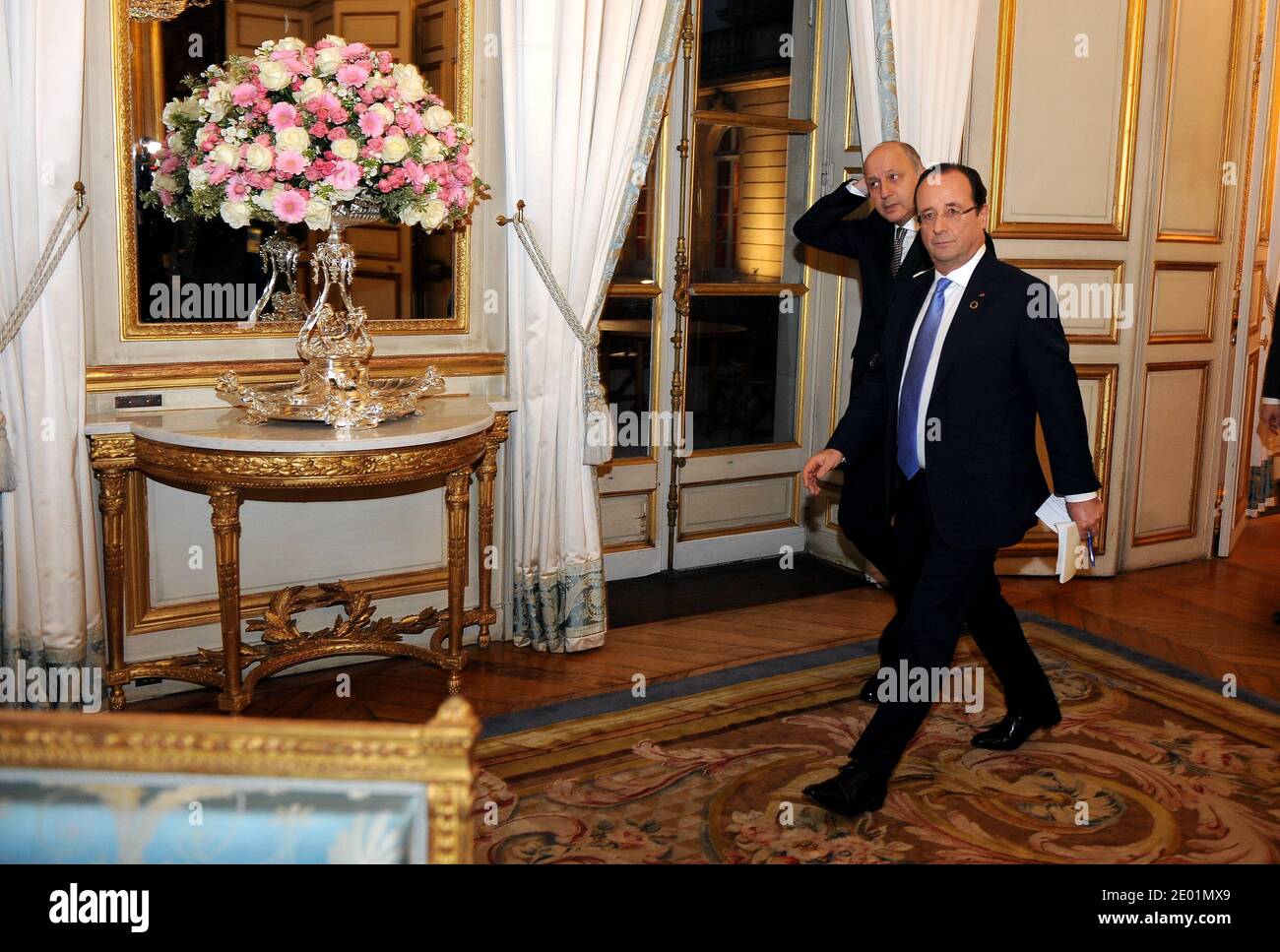 French President Francois Hollande (C) arrives alongside the French Minister of Foreign Affairs Laurent Fabius for a meeting dedicated to the situation in the Central African Republic, as part of a Summit for peace and safety in Africa at the Elysee presidential palace, in Paris, France, on December 7, 2013. Hollande on December 6 told African leaders it is time for their continent to take charge of its own security as a major summit went ahead against the sombre backdrop of the mourning for late former South African president Nelson Mandela. Photo by Mousse/ABACAPRESS.COM Stock Photo