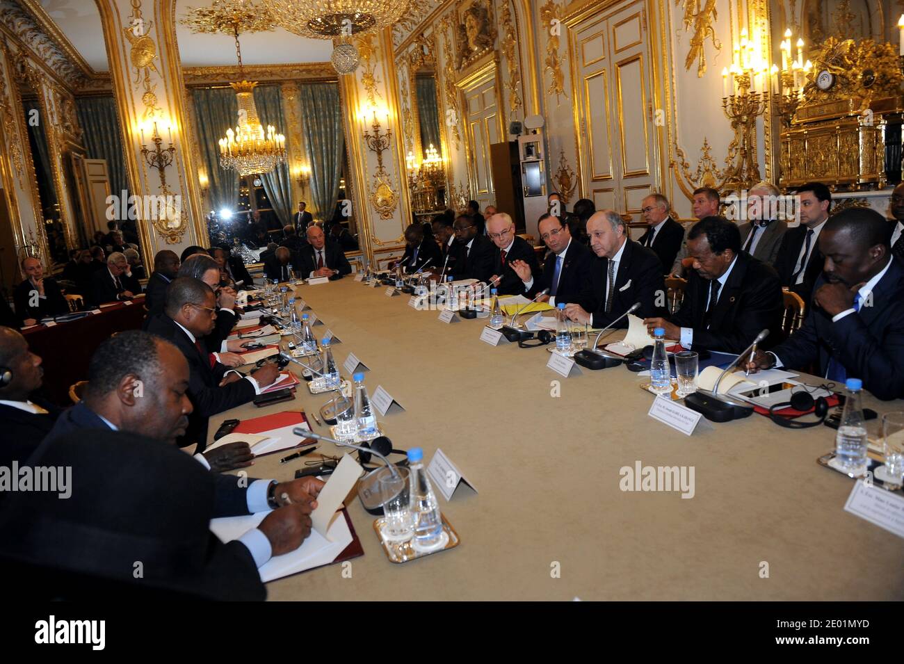 Central African Republic Prime Minister Nicolas Tiangaye (2nd L from bottom) takes part in a meeting about the situation in his country with Gabon's president Ali Bongo Ondimba (1st L), the President of the European Council Herman Van Rompuy (5th R), the French President Francois Hollande (4th R), the French Minister of Foreign Affairs Laurent Fabius (3rd R), and Cameroon's President Paul Biya (2nd R), as part of a Summit for peace and safety in Africa at the Elysee presidential palace, on December 7, 2013, in Paris, France. Hollande on December 6 told African leaders it is time for their cont Stock Photo