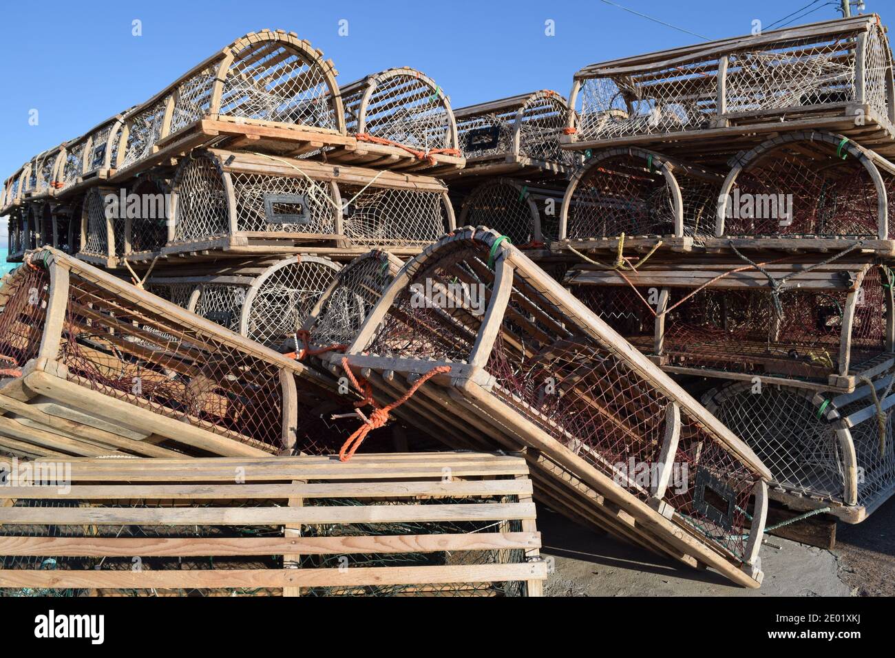 Lobster traps stacked on dock on Canadian east coast Stock Photo