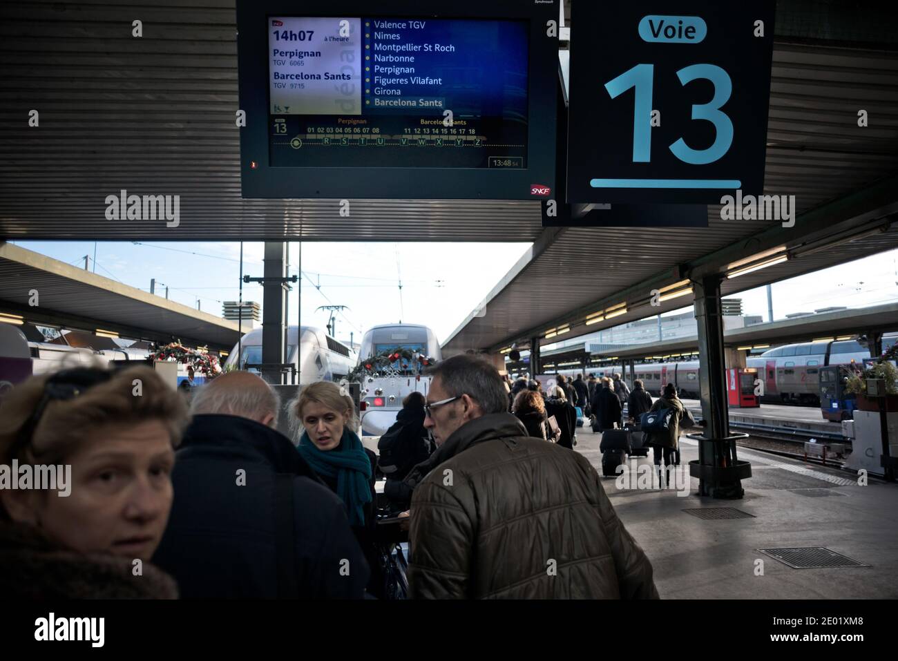 Atmosphere at Gare de Lyon station after the inauguration of the new TGV highspeed train line between France and Spain, in Paris, France on December 15, 2013. The new line which links Paris and Barcelona is jointly operated by the SNCF and its Spanish counterpart Renfe. Each day, two round trips will connect Paris to Barcelona. Photo by Nicolas Messyasz/ABACAPRESS.COM Stock Photo