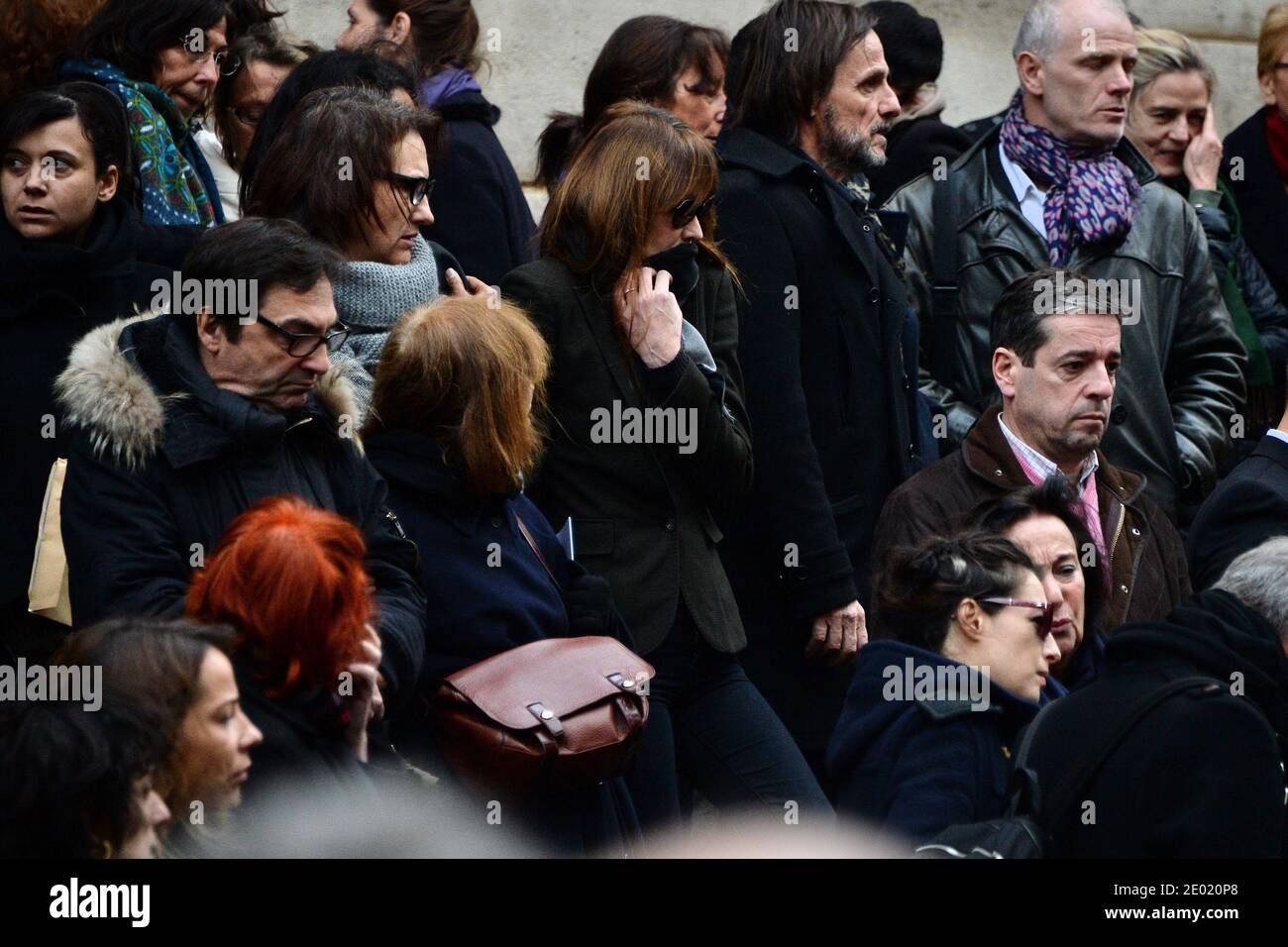 Please hide the children's faces prior to the publication Carla Bruni-Sarkozy attending a tribute mass for Kate Barry held at Saint Roch church in Paris, France on December 19, 2013. Photographer Kate Barry, the daughter of Jane Birkin and John Barry has been found dead on December 11 after falling from the window of her apartment in Paris. She was 46. Photo by ABACAPRESS.COM Stock Photo
