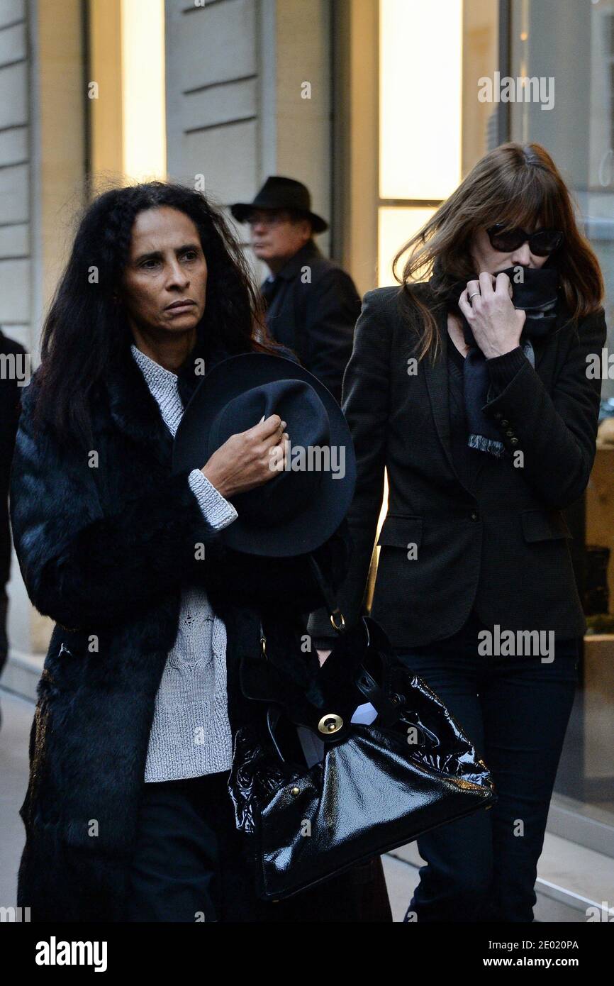 Please hide the children's faces prior to the publication Carla Bruni-Sarkozy and Karine Silla attending a tribute mass for Kate Barry held at Saint Roch church in Paris, France on December 19, 2013. Photographer Kate Barry, the daughter of Jane Birkin and John Barry has been found dead on December 11 after falling from the window of her apartment in Paris. She was 46. Photo by ABACAPRESS.COM Stock Photo