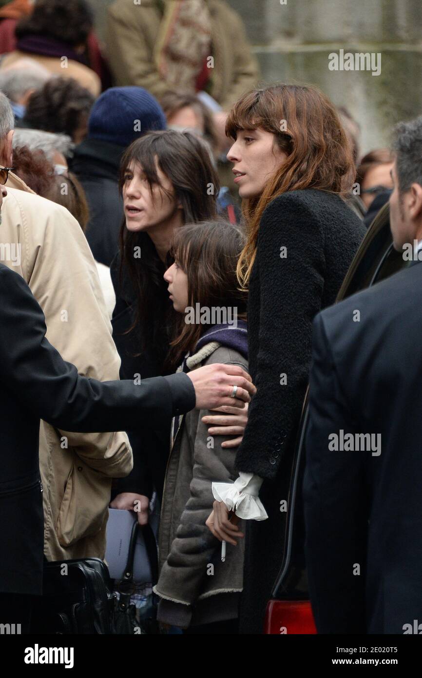 Please hide the children's faces prior to the publication Lou Doillon,  Charlotte Gainsbourg and her daughter Alice attending a tribute mass for Kate  Barry held at Saint Roch church in Paris, France
