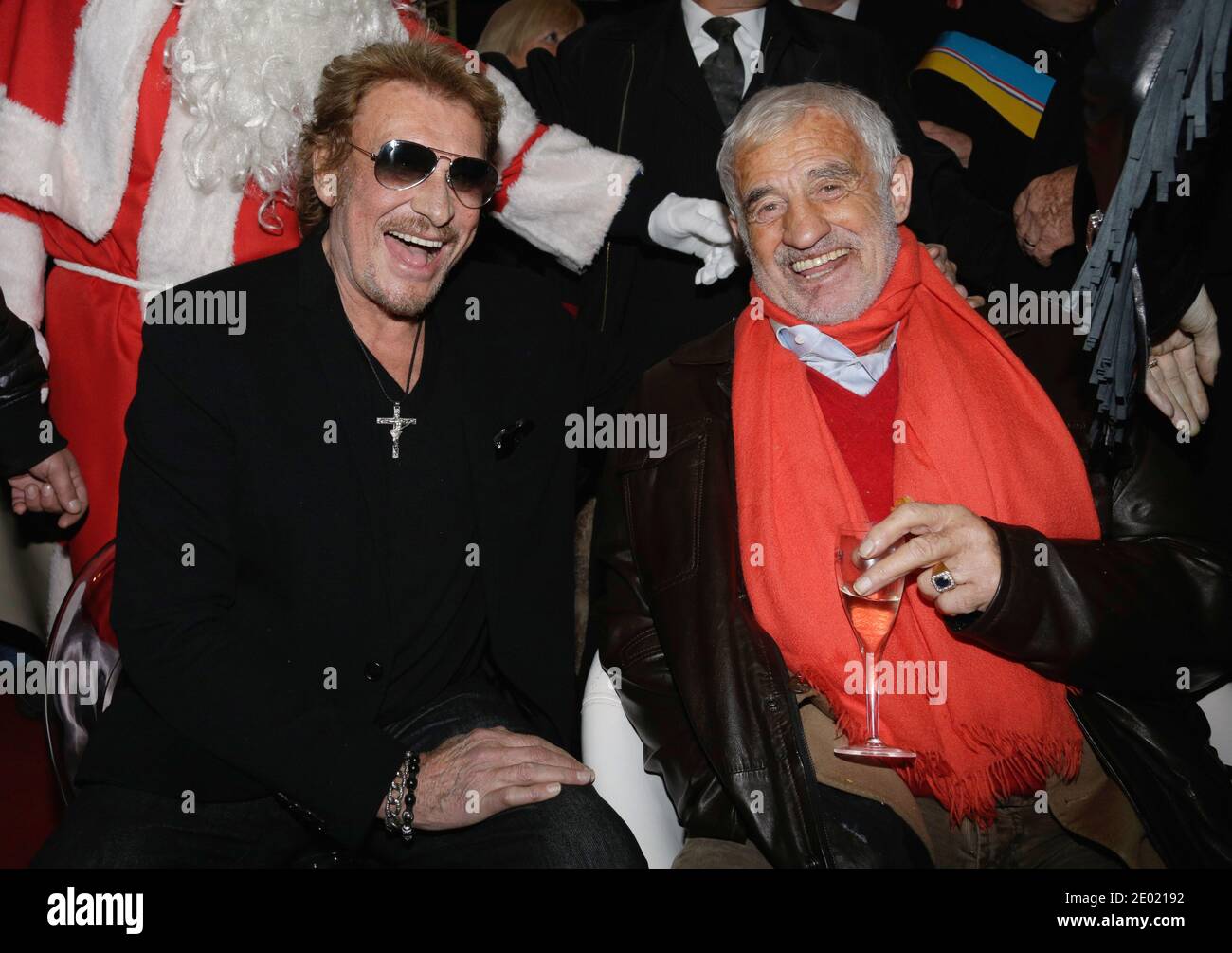 File photo : Johnny Hallyday and Jean-Paul Belmondo attending the Grand Palais funfair Party hosted by Marcel Campion in Paris, France on December 19, 2013. France's biggest rock star Johnny Hallyday has died from lung cancer, his wife says. He was 74. The singer - real name Jean-Philippe Smet - sold about 100 million records and starred in a number of films. Photo by Jerome Domine/ABACAPRESS.COM Stock Photo