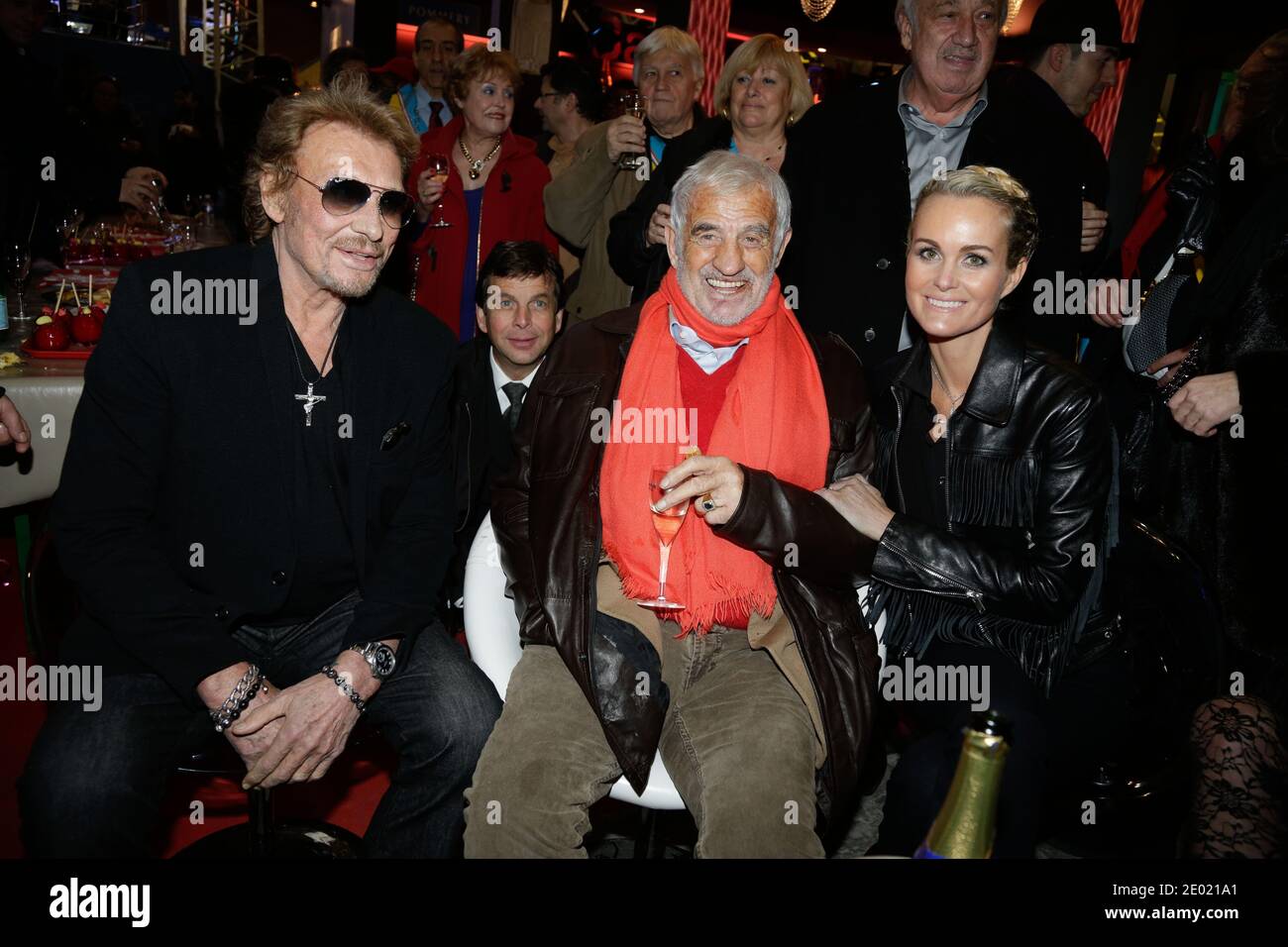 File photo : Johnny Hallyday, Laeticia Hallyday and Jean-Paul Belmondo attending the Grand Palais funfair Party hosted by Marcel Campion in Paris, France on December 19, 2013. France's biggest rock star Johnny Hallyday has died from lung cancer, his wife says. He was 74. The singer - real name Jean-Philippe Smet - sold about 100 million records and starred in a number of films. Photo by Jerome Domine/ABACAPRESS.COM Stock Photo