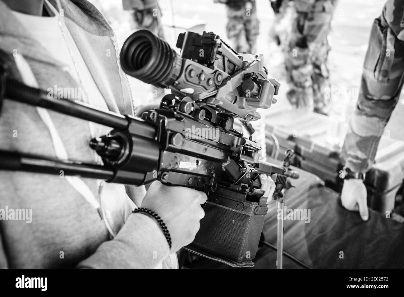 Strasbourg, France - Sep 21, 2019: Side view of male holding Heckler and Koch HK416 assault rifle designed and manufactured by the German company with Stock Photo