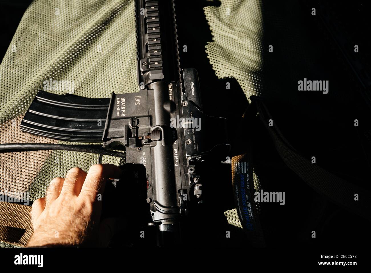 Strasbourg, France - Sep 21, 2019: Man hand on the ready to shoot Heckler and Koch HK416 assault rifle designed and manufactured by the German company Stock Photo