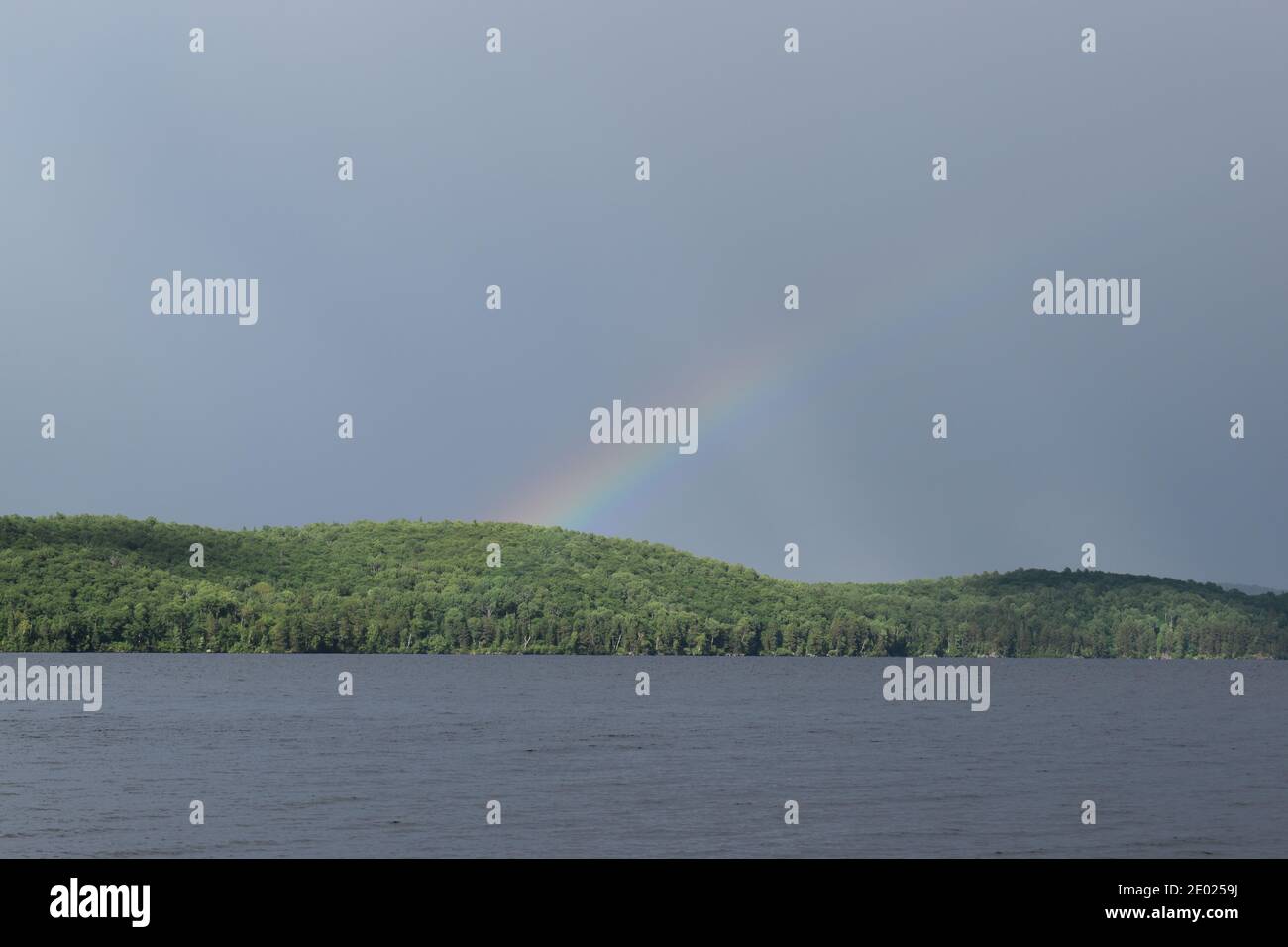 A rainbow after a summer's storm Stock Photo - Alamy