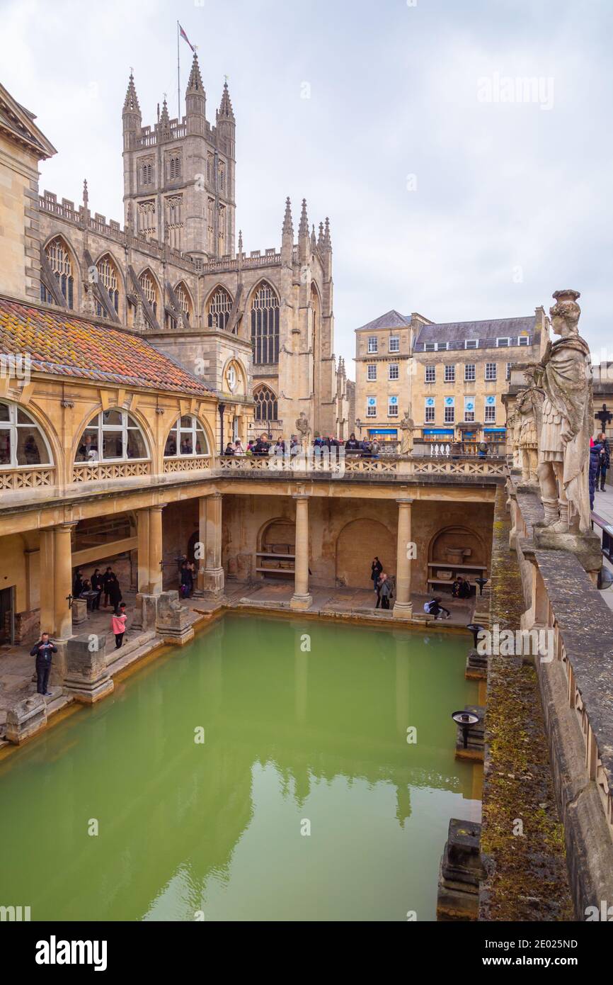 Overlooking the historical Roman Baths with Bath Abbey in the background in the town of Bath, United Kingdom. Stock Photo