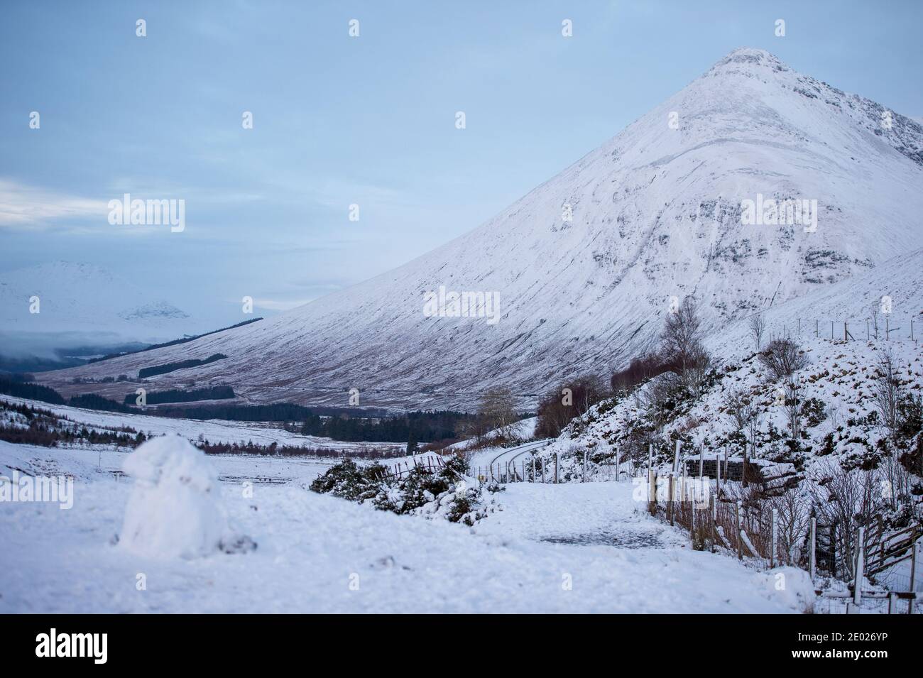 Glencoe, Scotland, UK. 28th Dec, 2020. Pictured: Snow covered highland landscape north of Tyndrum. Snow still lying on the hills from overnight snow fall from Storm Bella. Freezing temperatures with a Yellow Warning still in place issued by the MET Office. Credit: Colin Fisher/Alamy Live News Stock Photo