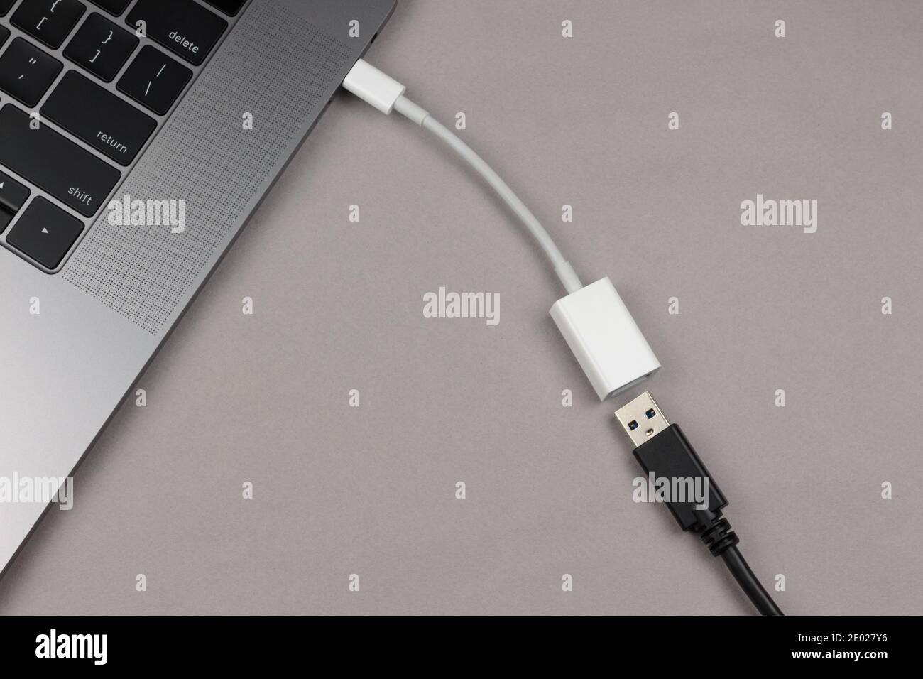 usb-c to usb adapter connected to a with usb next to