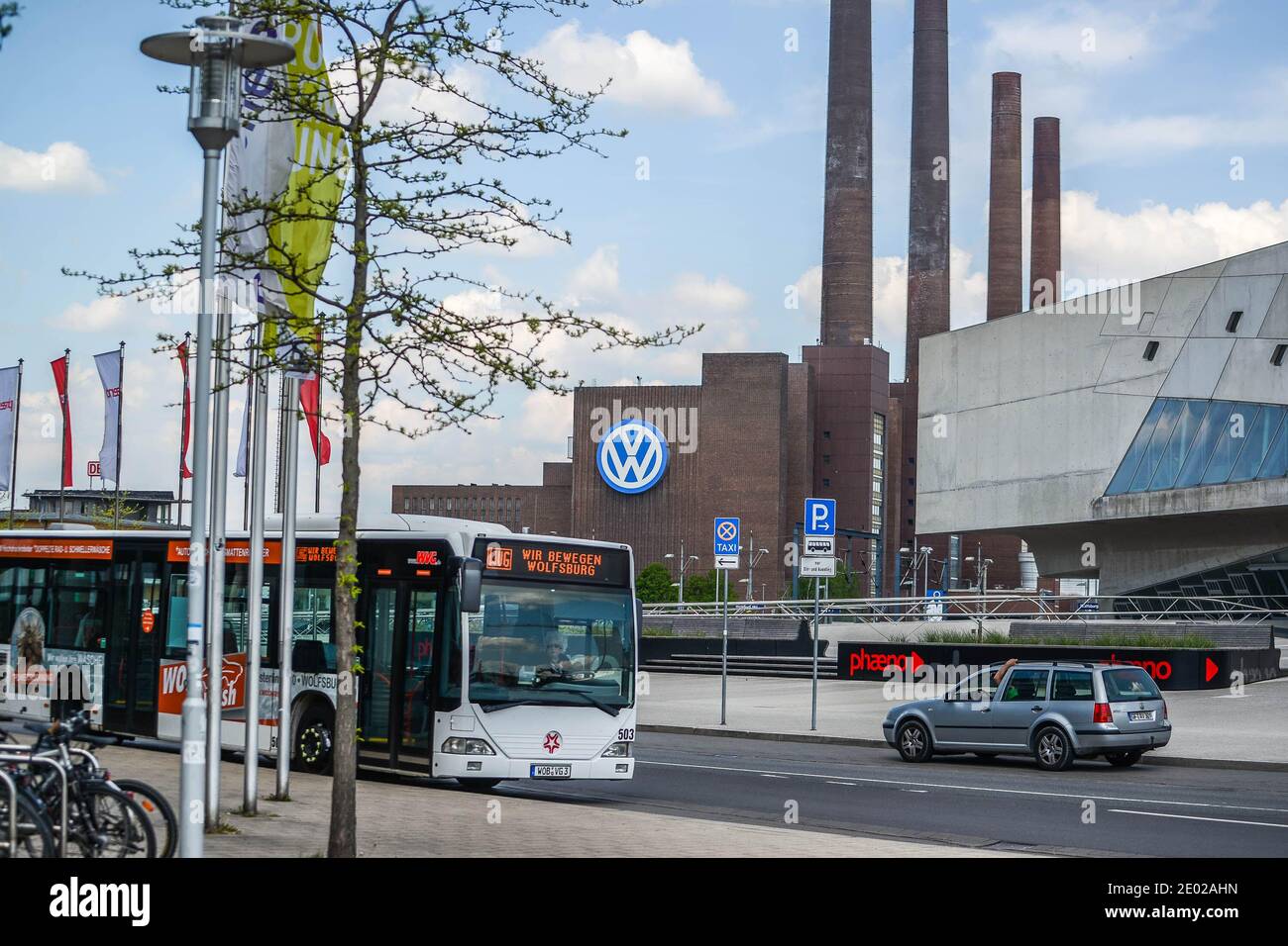 Wolfsburg, Germany. JULY 2015. View of the old Volkswagen factory building with the VW logo illuminated. The plant is located on the banks of the Central German Canal. Urban city life. Cars. City views. Stock Photo