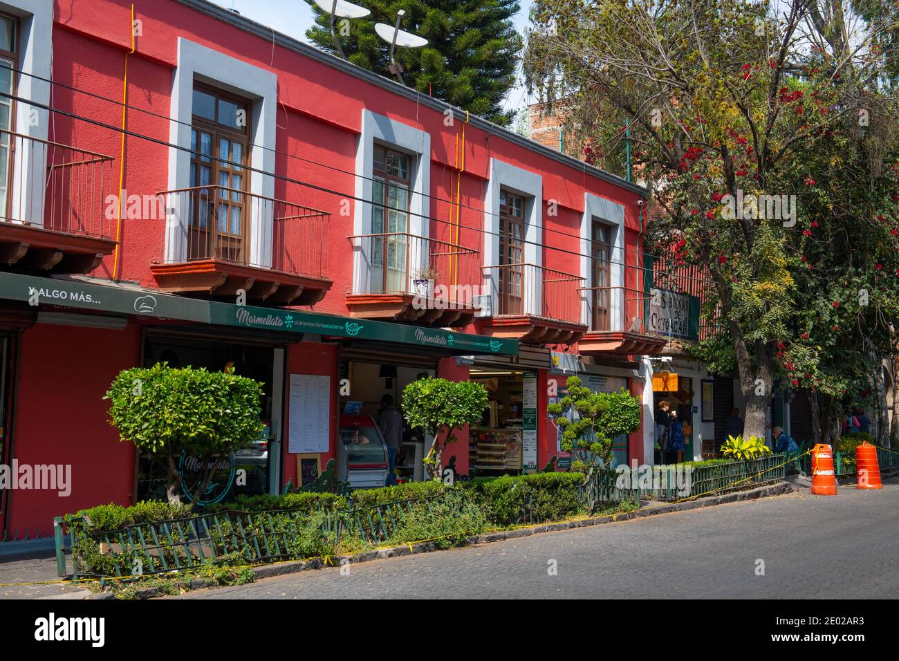 Historic buildings on Felipe Carrillo Puerto Street at Francisco Ortega Street in historic center of Coyoacan, Mexico City CDMX, Mexico. Stock Photo