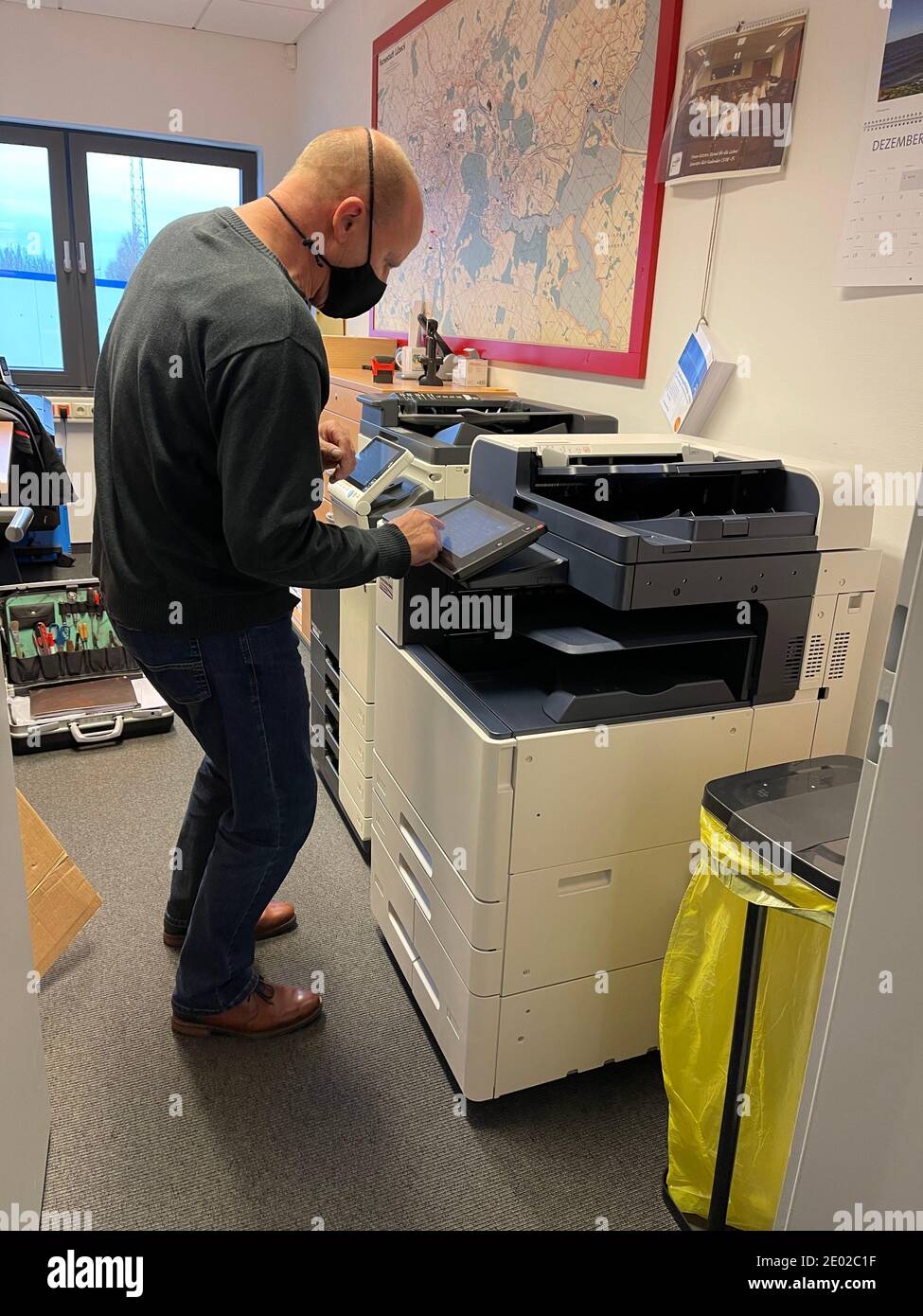 a technician repairs a copier in a printer room Stock Photo Alamy