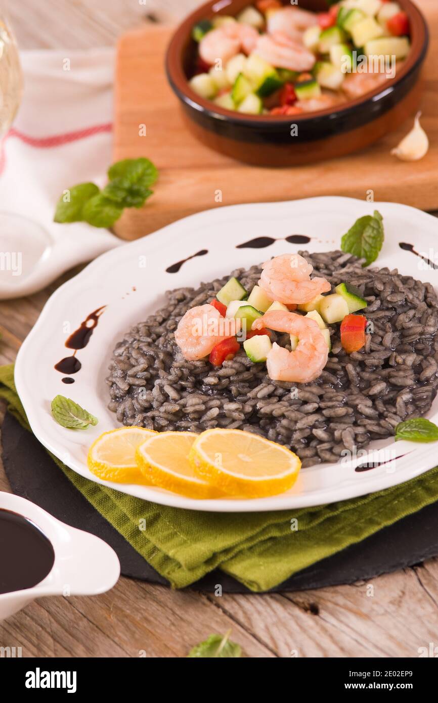 Squid ink risotto Stock Photo - Alamy