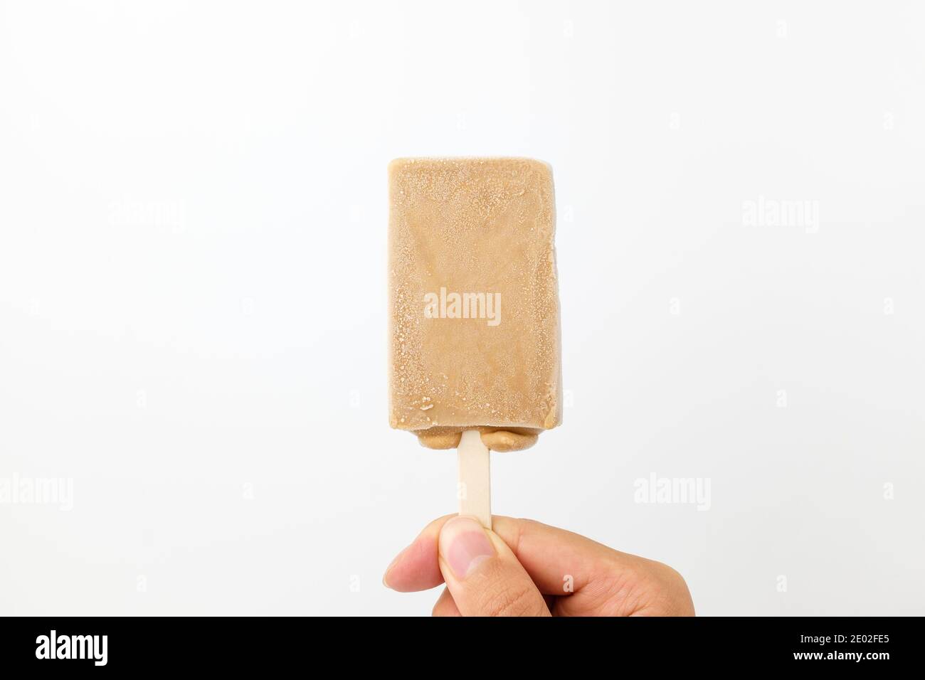 Caramel ice cream on white background Stock Photo - Alamy