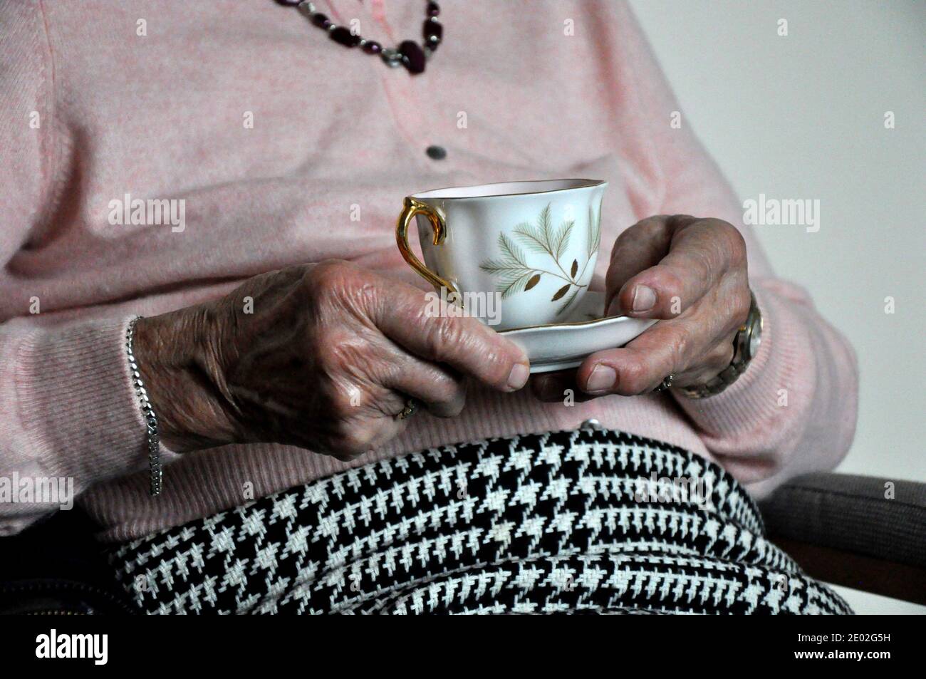 File photo dated 02/04/16 of an elderly woman holding a cup of tea. Better brain function in older people can be added to the list of health benefits associated with drinking tea, researchers have found. Stock Photo