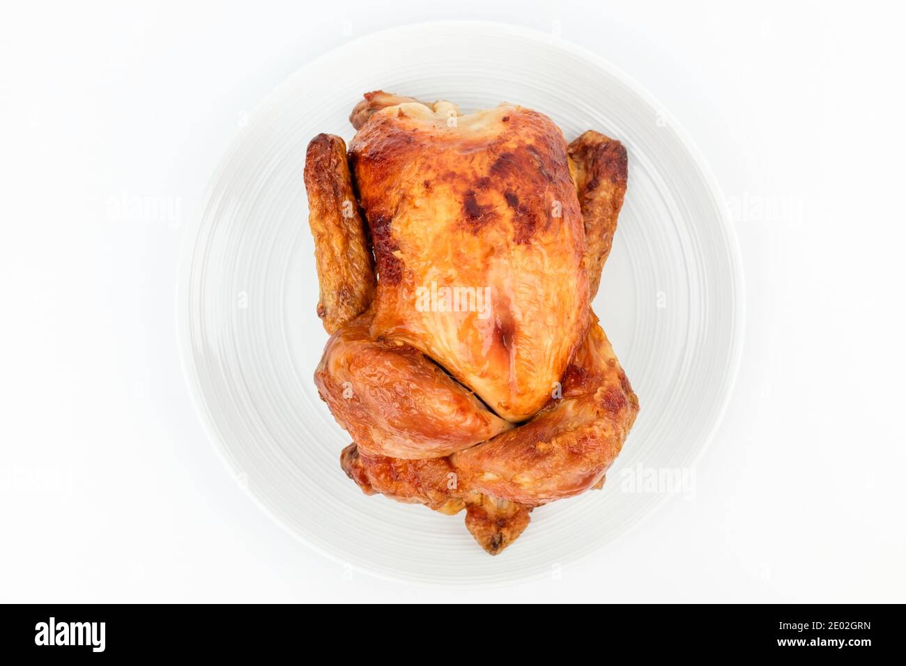Roast chicken on white background Stock Photo - Alamy