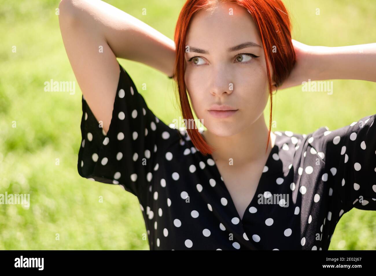 Portrait of beautiful young woman with red hair Stock Photo - Alamy