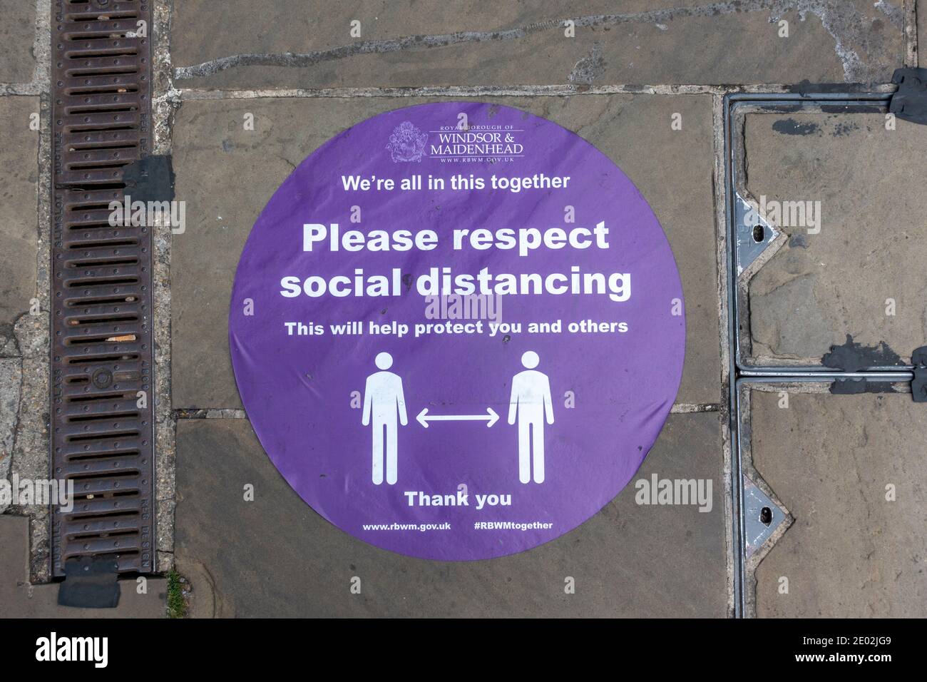 'Please Respect social distancing' sign on the ground reminding people to socially distance during the 2020 Covid-19 pandemic, Windsor, Berkshire, UK. Stock Photo