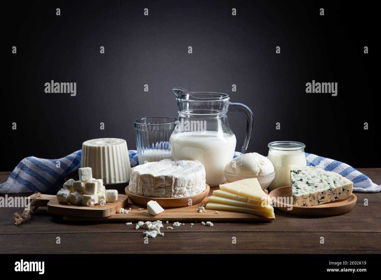 Dairy products on  wooden base and dark background with copy space. Stock Photo
