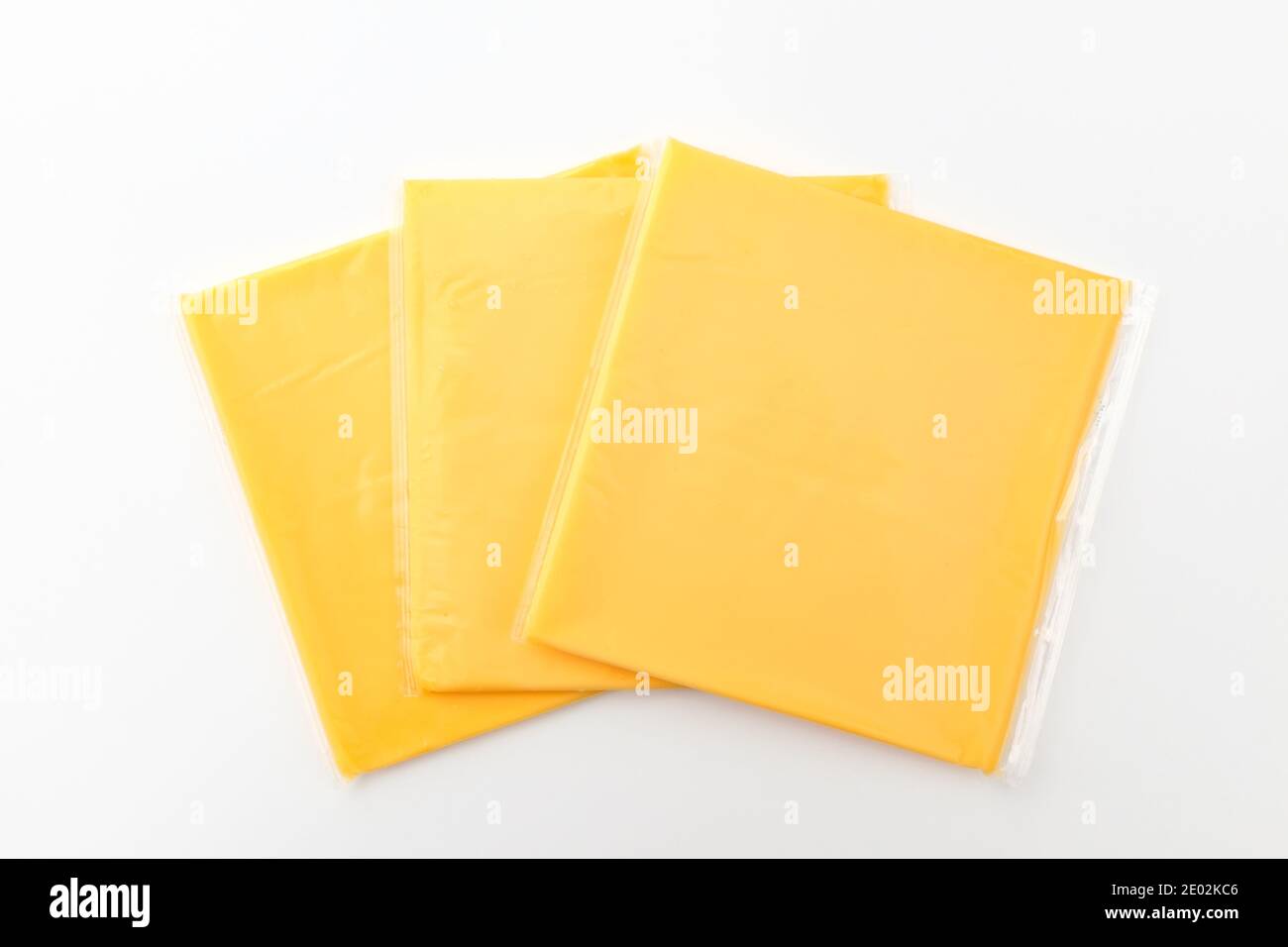 Square cheddar cheese. Sliced cheese. Processed food made from milk