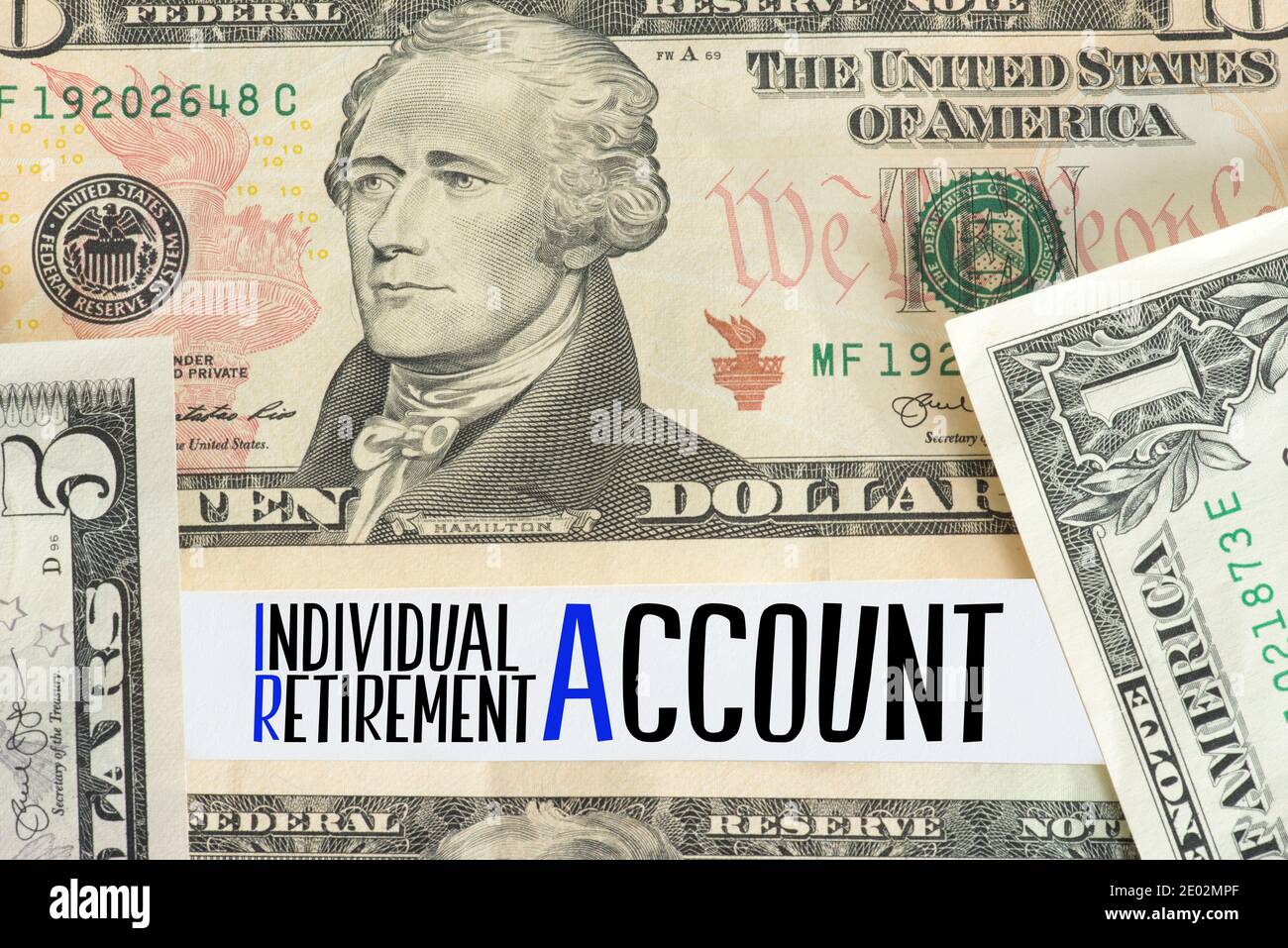 Dollar banknotes and IRA Individual Retirement Account Stock Photo - Alamy