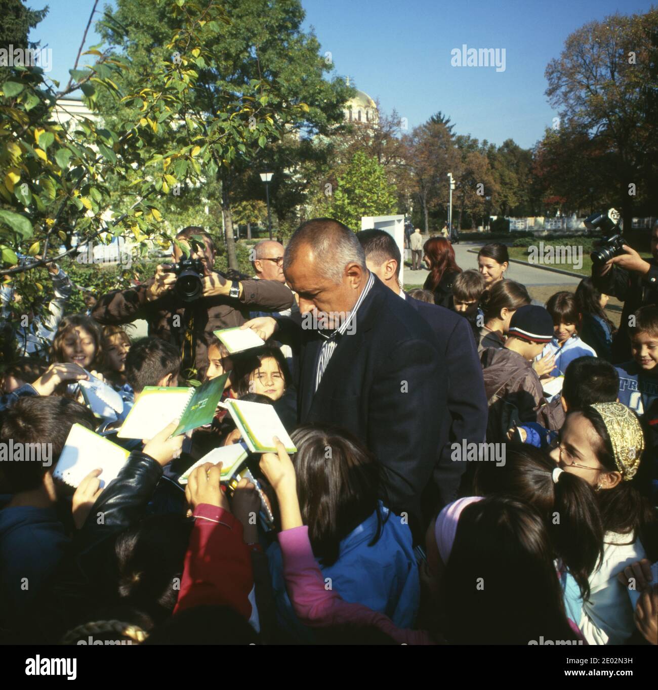 Sofia Mayor Boyko Borisov gives autographs to children in the garden next to the parliament. Sofia, Bulgaria, 2008 Stock Photo