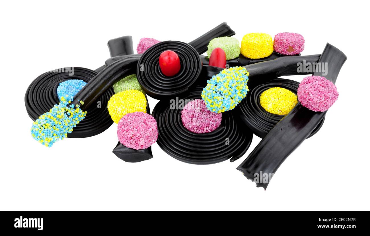Group of novelty liquorice sweets including Catherine wheels, spinning tops and traffic lights isolated on a white background Stock Photo
