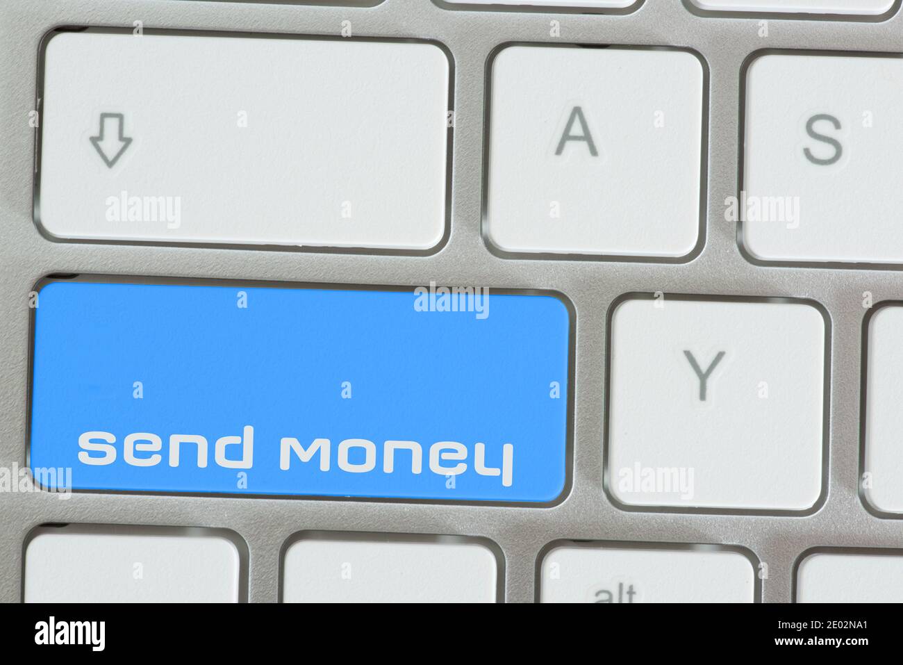 A computer and key to send money Stock Photo