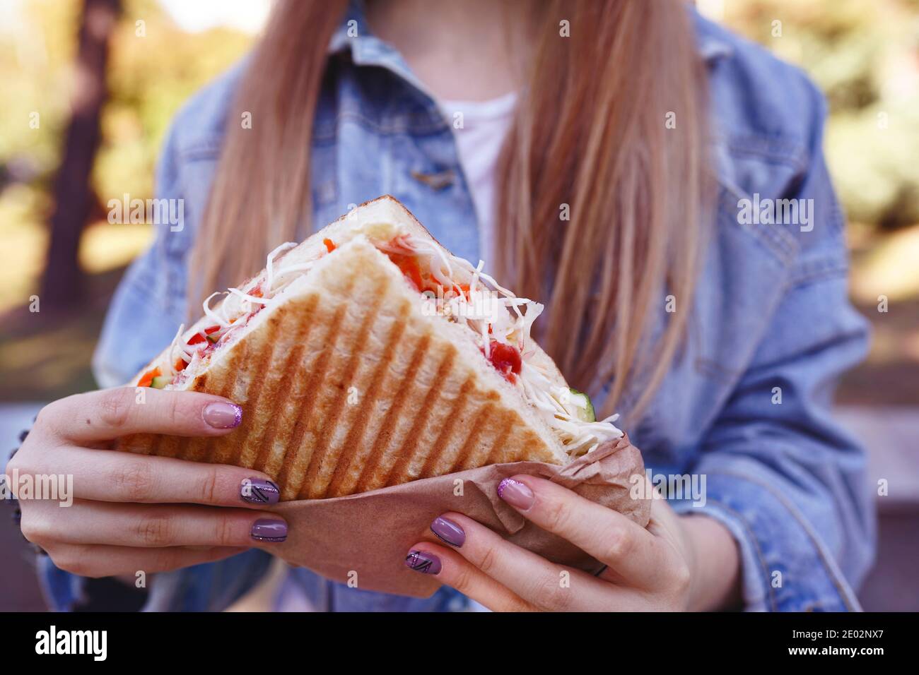 Girl eats sandwich hires stock photography and images Alamy