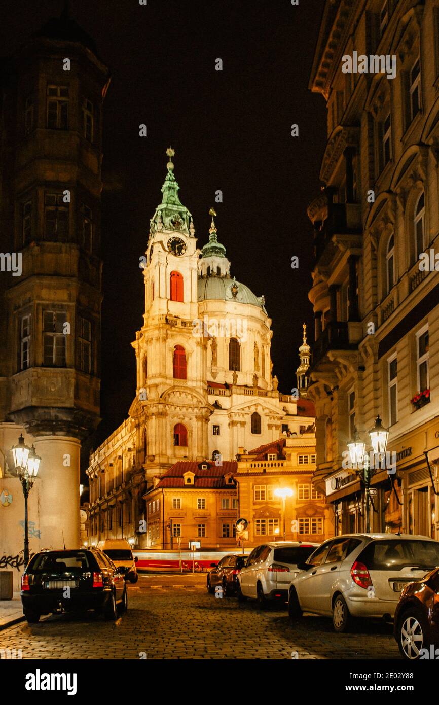 Night view of the illuminated St Nicolas church, Malostranske namesti,Prague,Czech republic.Baroque church in the Lesser Town of Prague.Night city sce Stock Photo