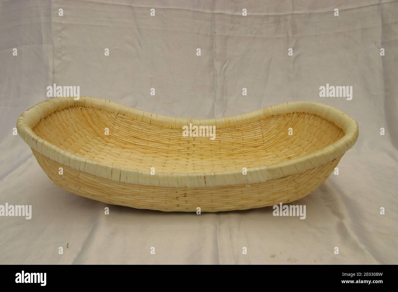 Empty boat shape wicker basket isolated. Bread, fruit storage container