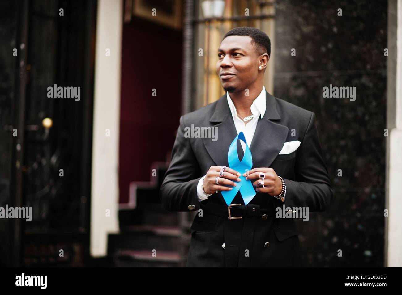 African american man hold blue prostate ribbon. Awareness cancer of men ...