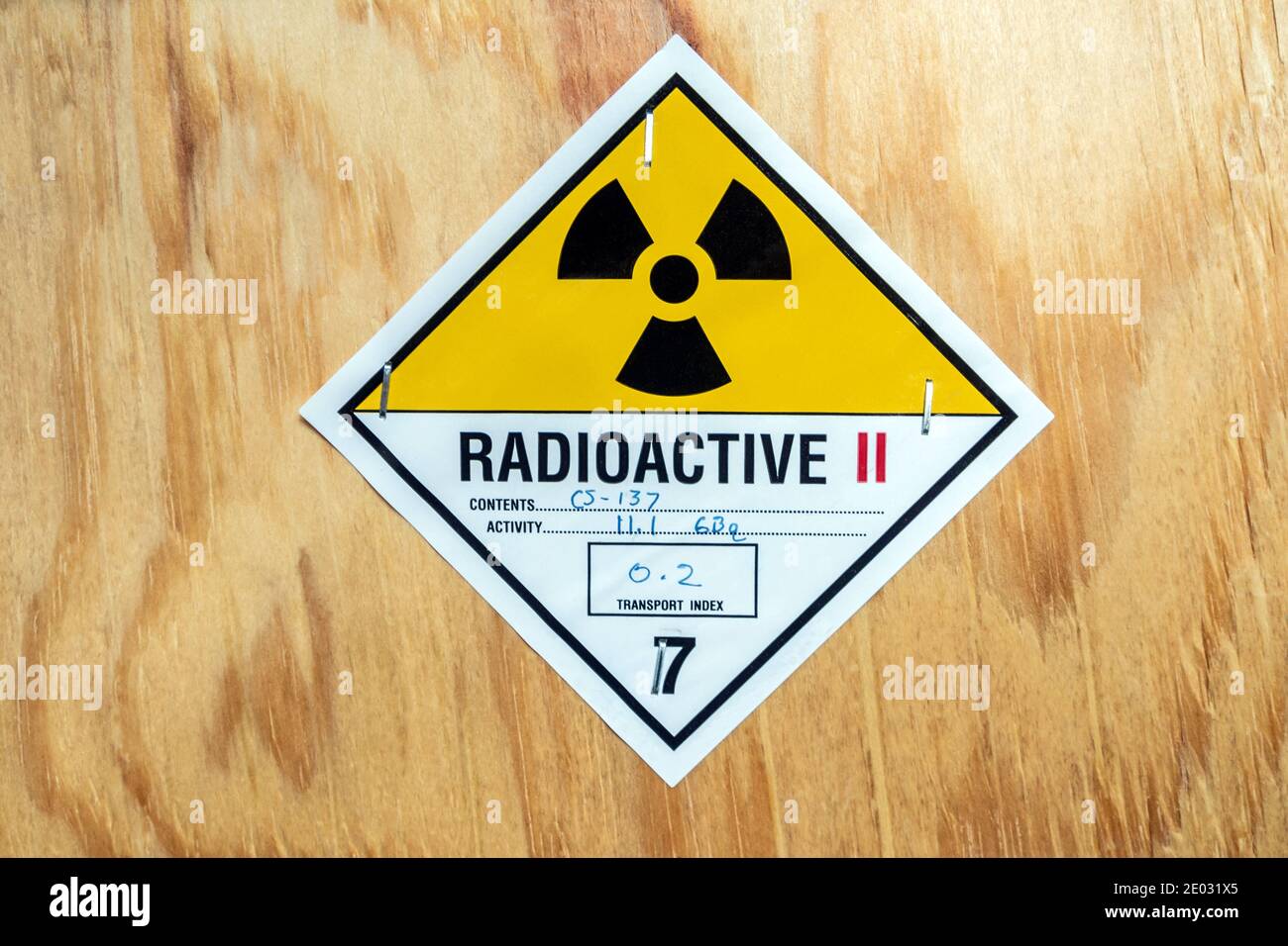 The radioactive material label beside the transportation wooden box