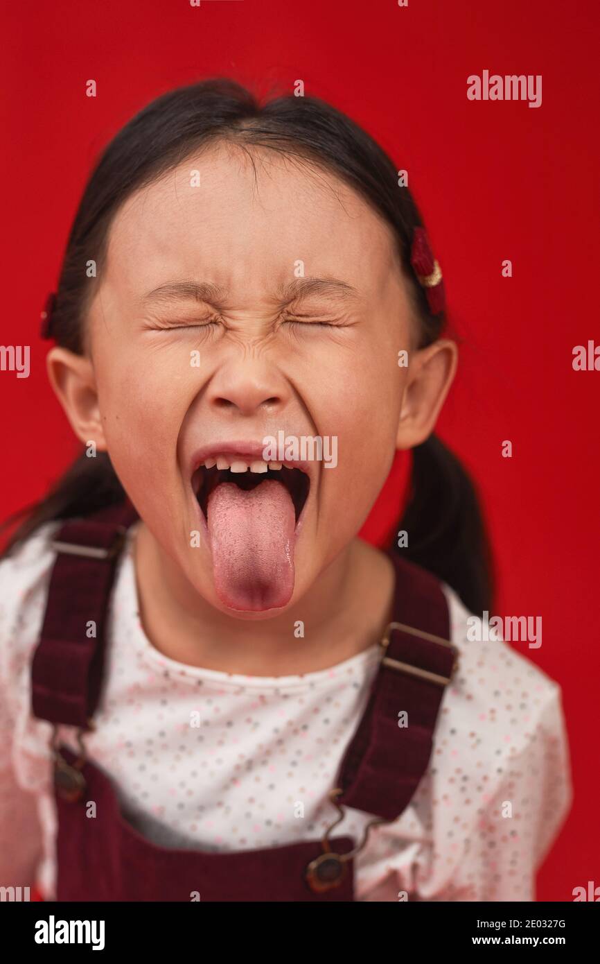 Girl Closed Eyes Sticking Out Tongue High Resolution Stock Photography and  Images - Alamy
