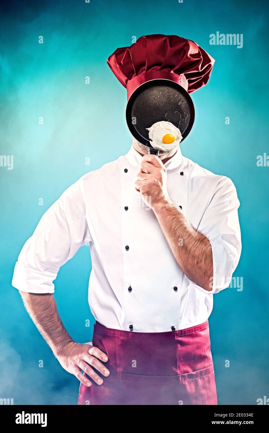 Chef holding pan with fried egg Stock Photo Alamy