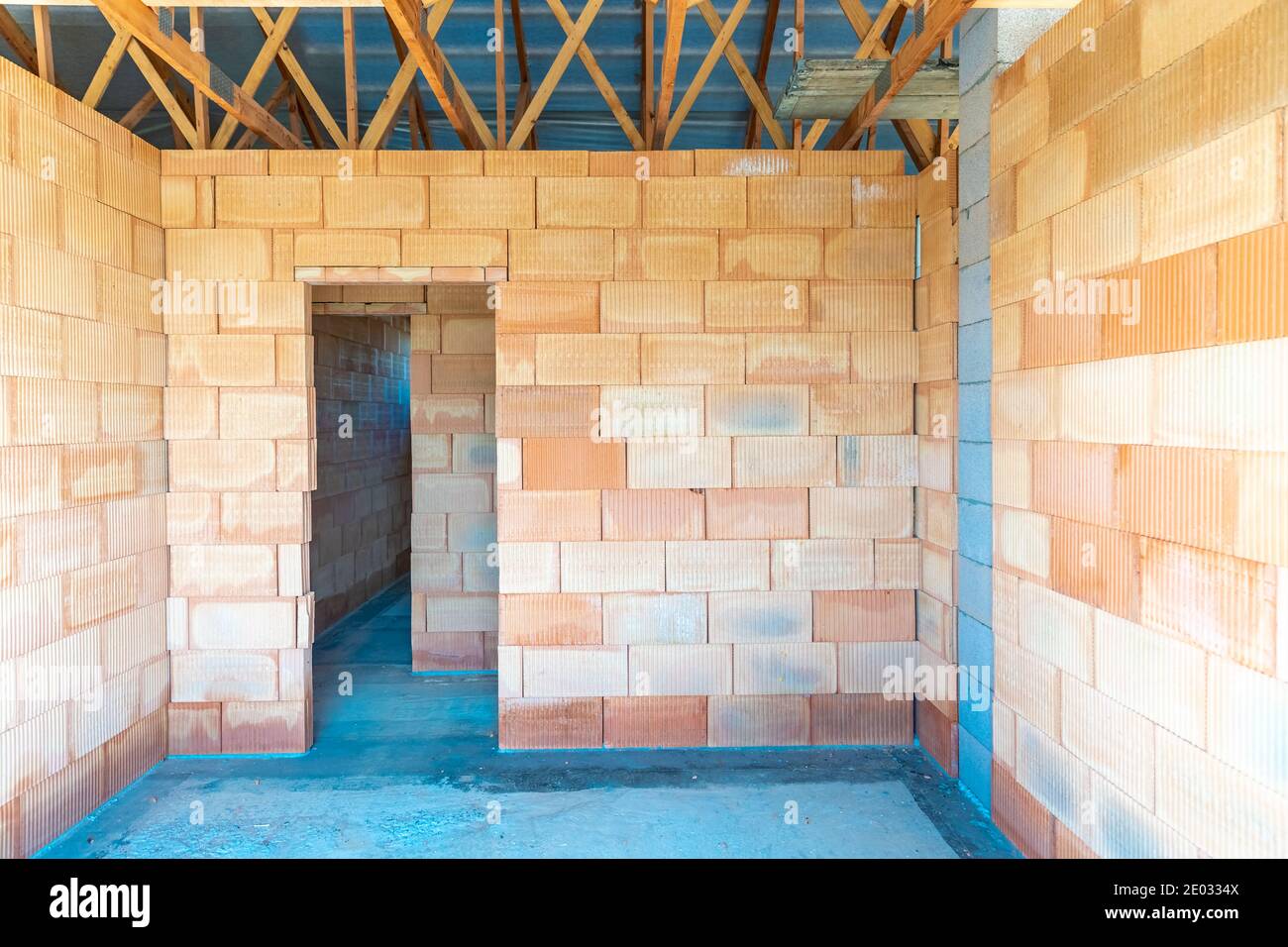 rough construction of a brick family house Stock Photo - Alamy