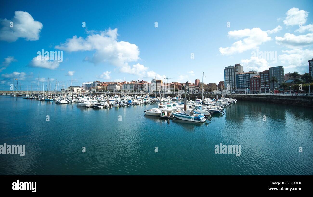 Yachts and boats docking at port at sunset Stock Photo Alamy