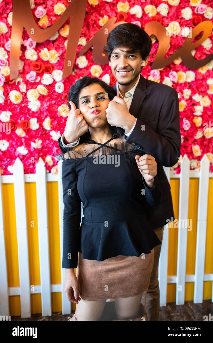 Young happy cheerful indian couple in love have fun indoor against floral  background, boyfriend girlfriend relationship, new year or valentines day  Stock Photo - Alamy