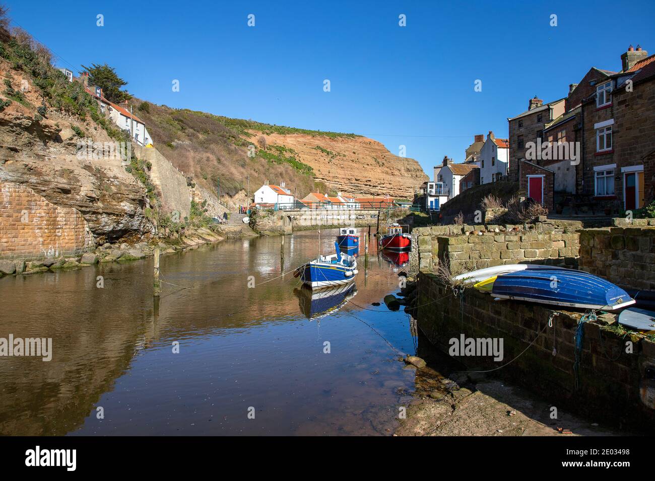 Staithes harbour, a once important fishing port, also known for its ...