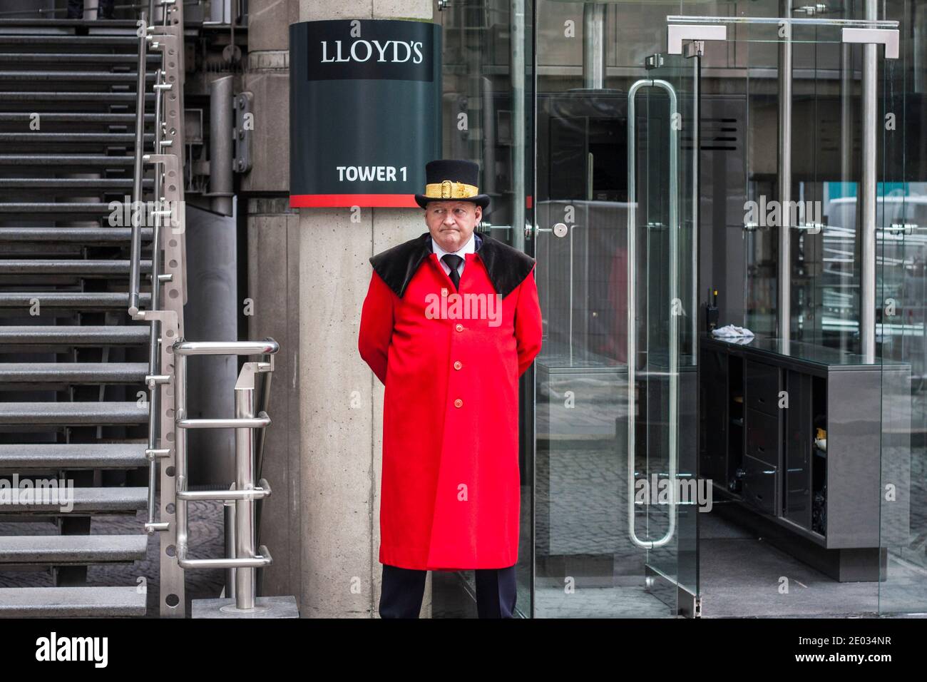 Lloyds of London,England,UK with the  commissionaire  stood outside in his red coat and top hat. Stock Photo