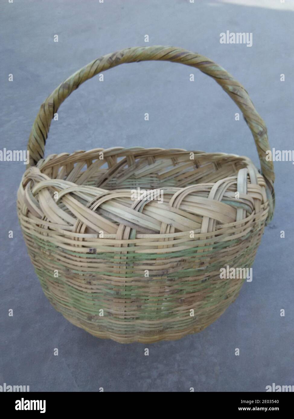 Closeup of handmade bamboo picnic basket, front view of empty wicker