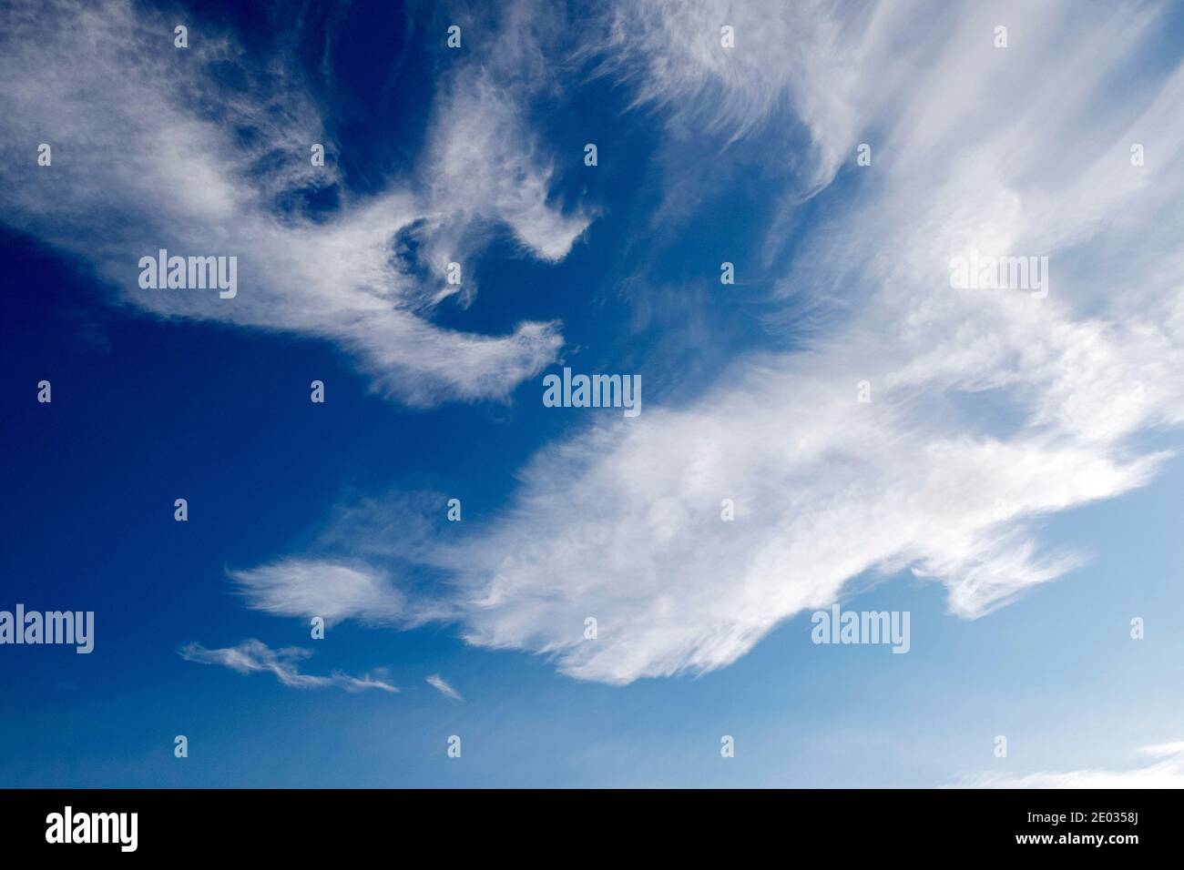 Cirrus clouds forming the letter C shape in blue sky in winter in December 2020 Wales UK Great Britain   KATHY DEWITT Stock Photo