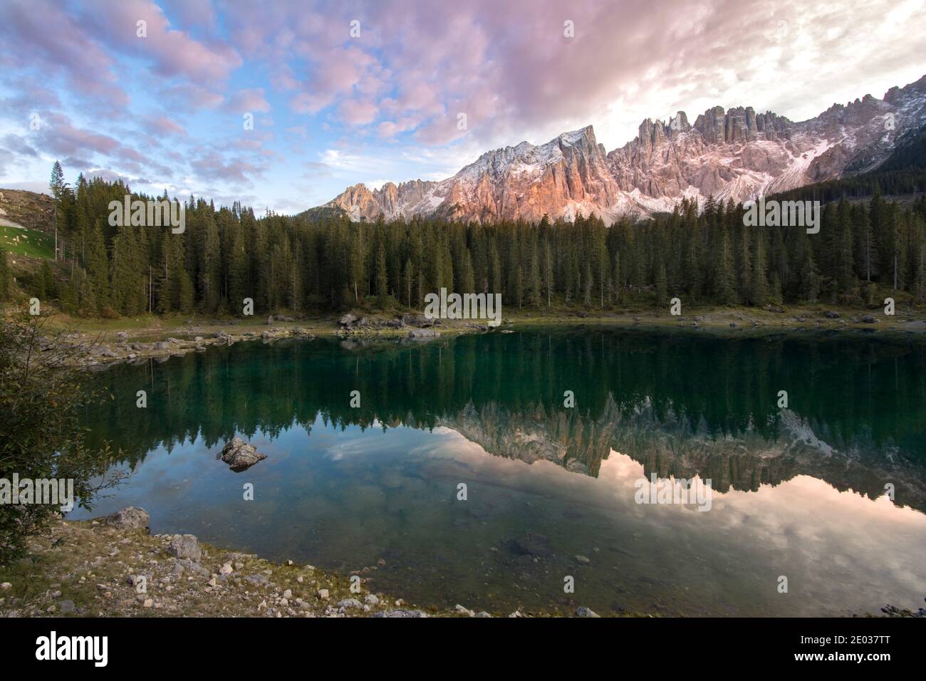 sunset on Carezza Lake in Trentino Alto Adige in Italy Stock Photo