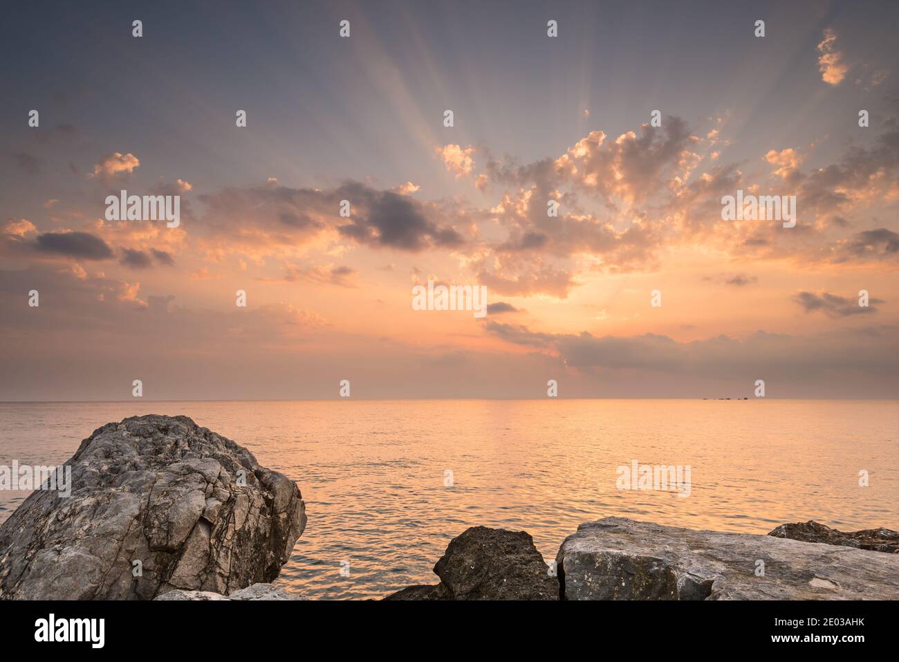 Rocky shore during sunrise in Tsilivi Zakinthos Greece Stock Photo