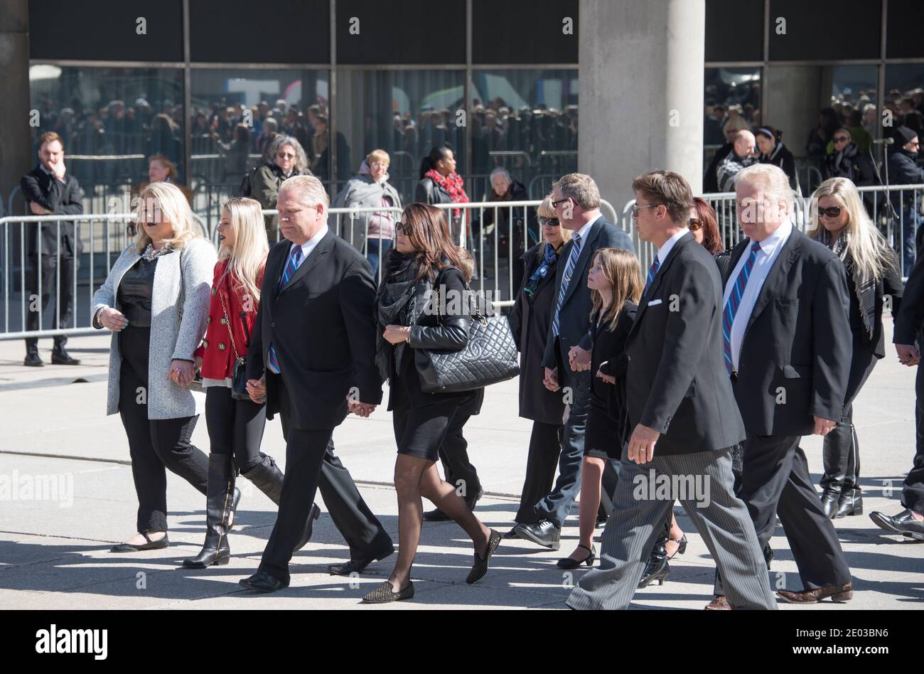 Ford Family leaving Nathan Phillips Square during Rob Ford funeral march towards St. James Cathedral where the Good Bye service will be held. Stock Photo