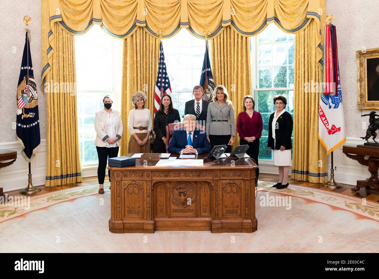 U.S President Donald Trump, joined by First Lady Melania Trump and guests, signs H.R. 473 to Authorize the Every Word We Utter Monument for the District of Columbia in the Oval Office of the White House December 17, 2020 in Washington, D.C. Stock Photo