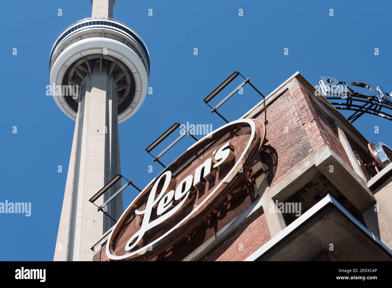 Leon's sign and The CN Tower, Toronto, CanadaApril 2016 Stock Photo