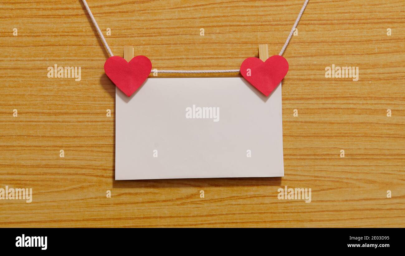 Mockup photo frame with two red hearts, empty space for text. Blank ...